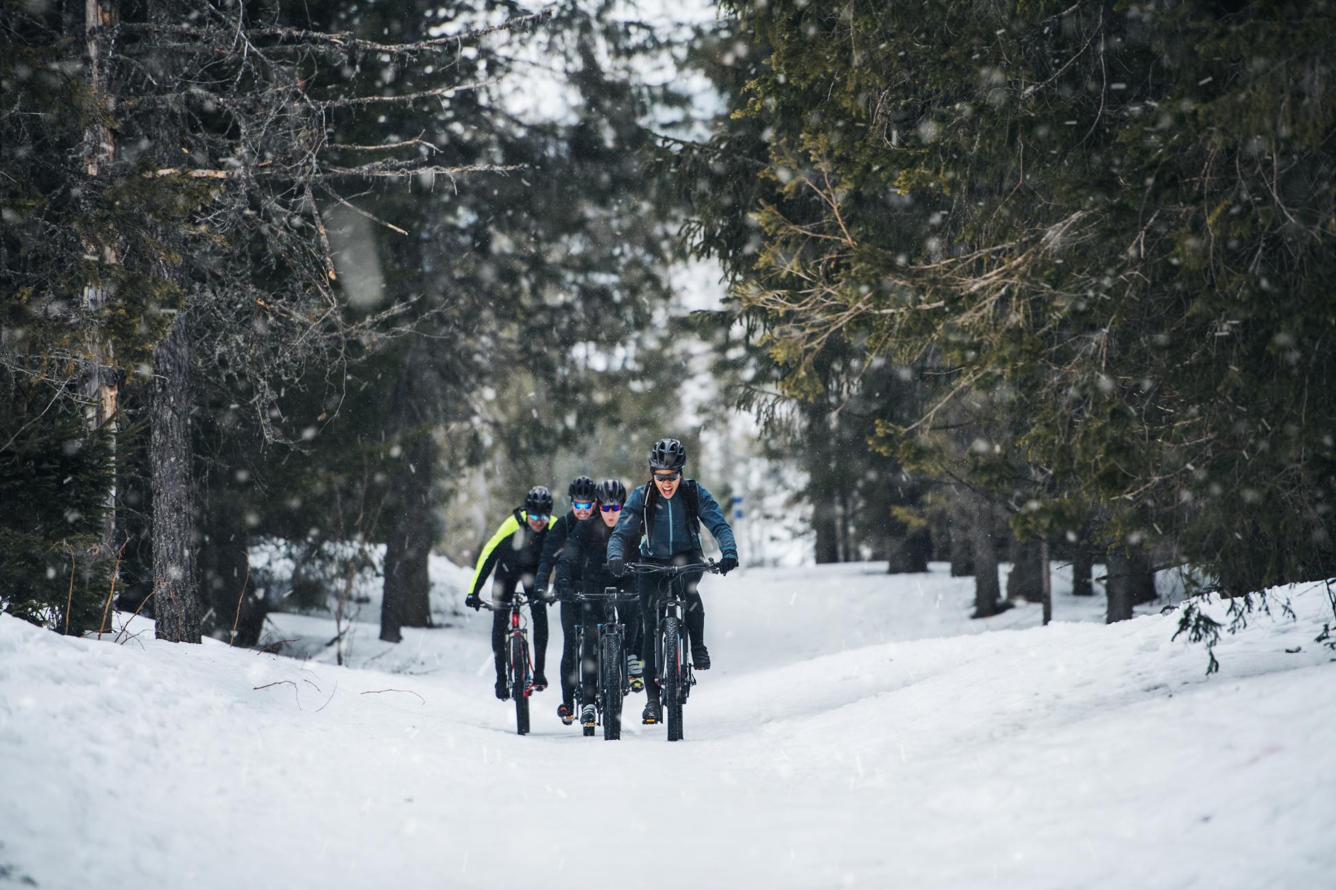 group-of-mountain-bikers-riding-on-road-outdoors-i-2021-08-27-16-22-27-utc