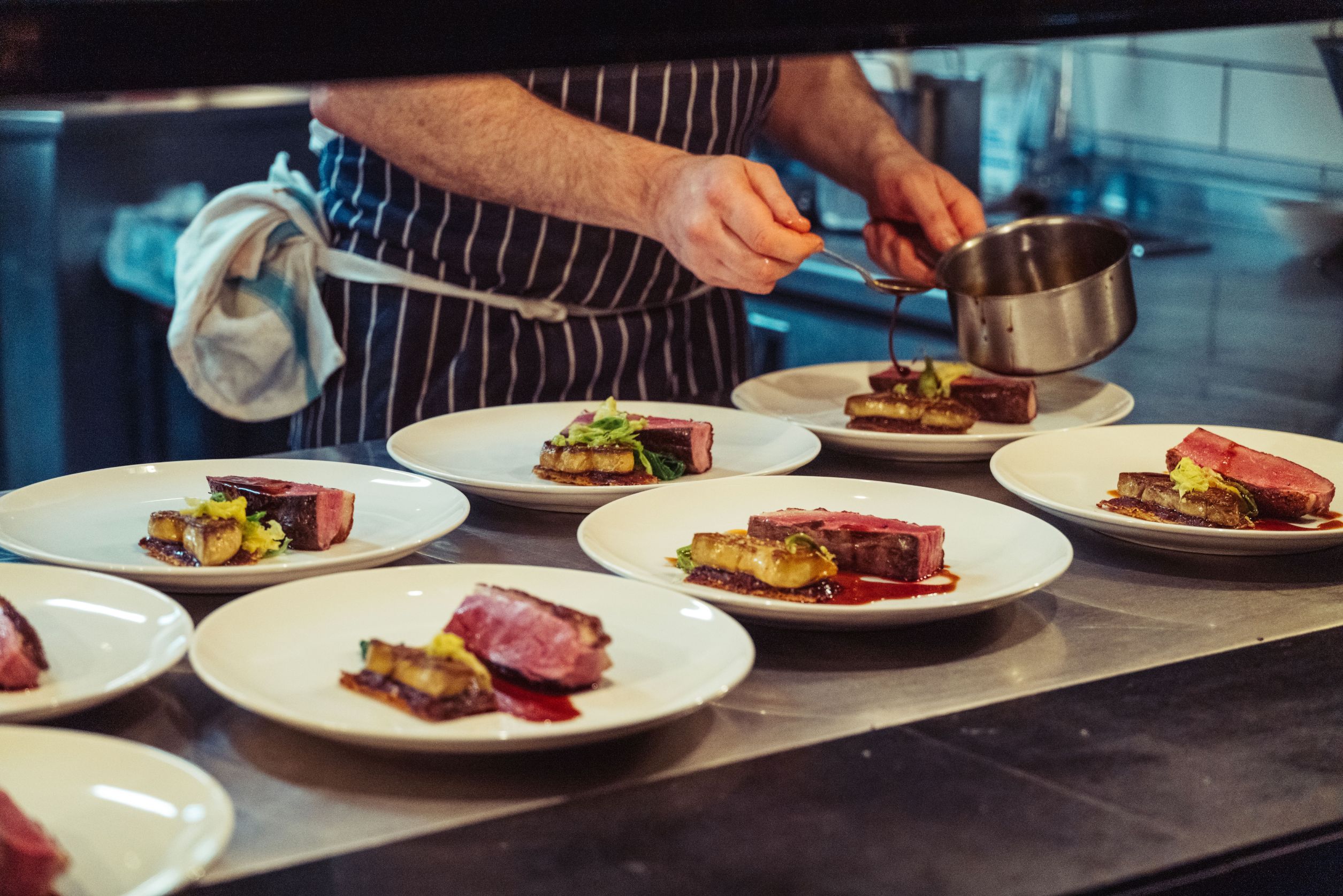 the-hands-of-the-chef-preparing-a-fine-dinner-in-t-2023-01-04-00-28-53-utc